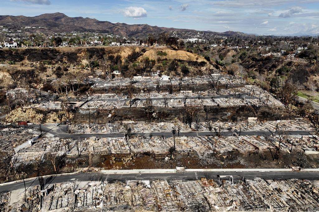 An aerial view shows the devastation left by the Palisades Fire in the Pacific Palisades section of Los Angeles, Monday, Jan. 27, 2025.