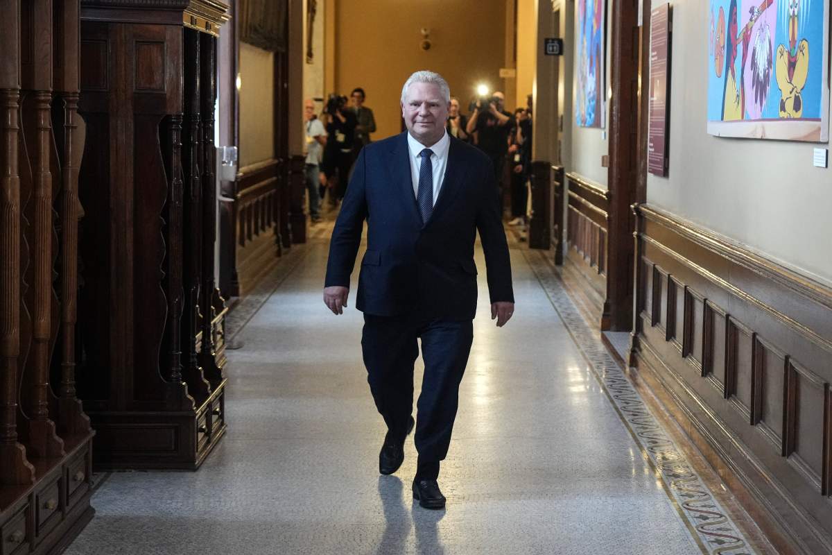 Ontario Premier Doug Ford walks towards the offices of Lt.-Gov. Edith Dumont before requesting to dissolve the provincial parliament and hold elections, at Queens Park, the provincial legislature, in Toronto, Tuesday, Jan. 28, 2025.