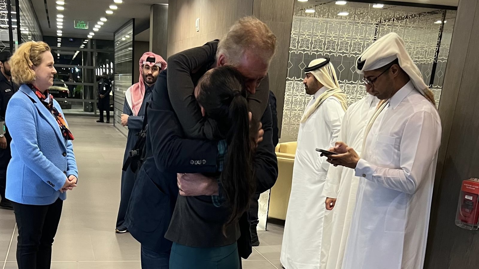 Canadian Dave Lavery is reunited with wife Junping at Doha airport, Qatar.
