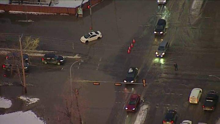 A car is seen stuck in water in central Edmonton on Jan. 14, 2025.