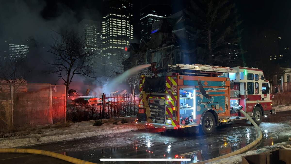 A condo complex in Calgary's Eau Claire area that had already been fenced off and was set to be demolished caught fire on Tuesday night.