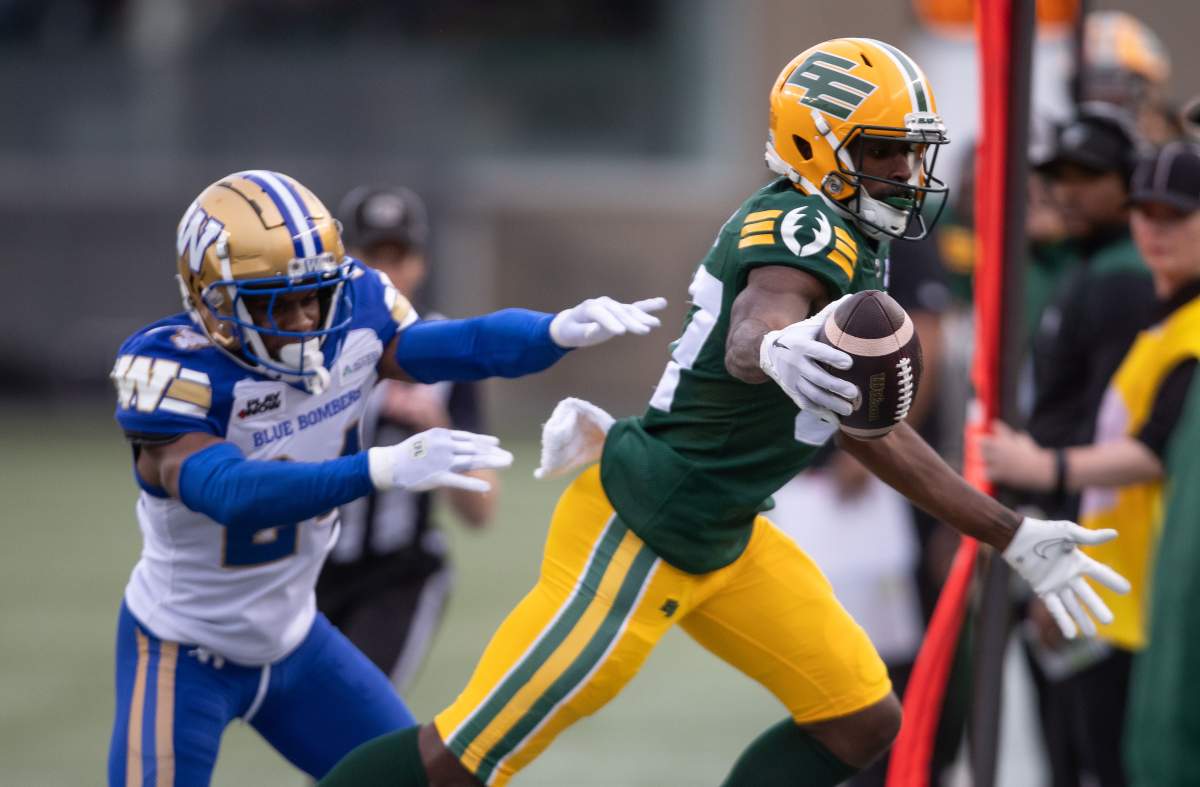 Winnipeg Blue Bombers' Terrell Bonds (left) shoves Edmonton Elks' Eugene Lewis (87) out of bounds during first half CFL action in Edmonton, on Saturday September 21, 2024.