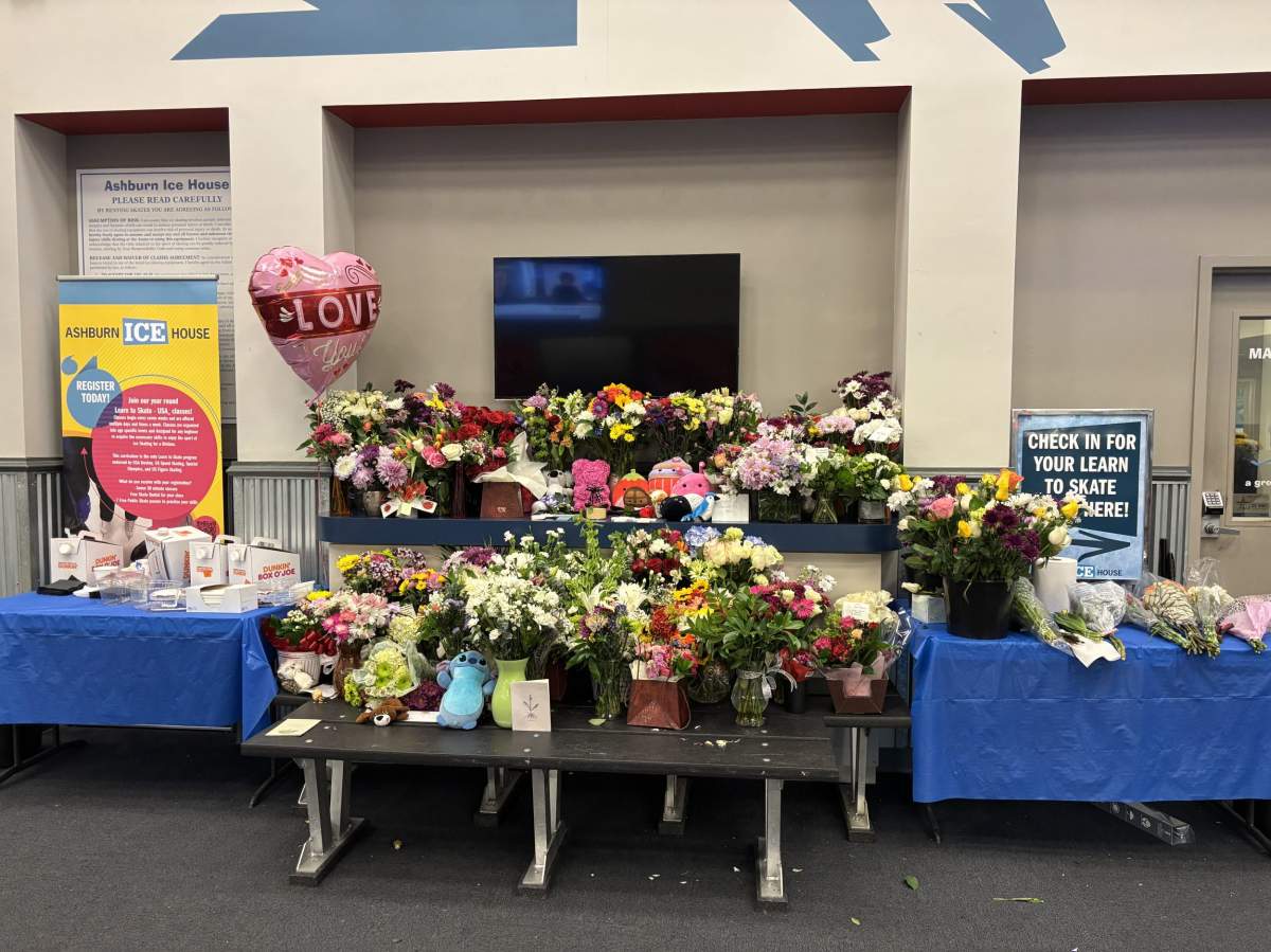 Flowers and other gifts adorn a tribute wall set up at the Ashburn Ice House in Ashburn, Va., to honour the victims of the midair collision between a passenger jet and a military helicopter near Washington, D.C., on Jan. 30, 2025.