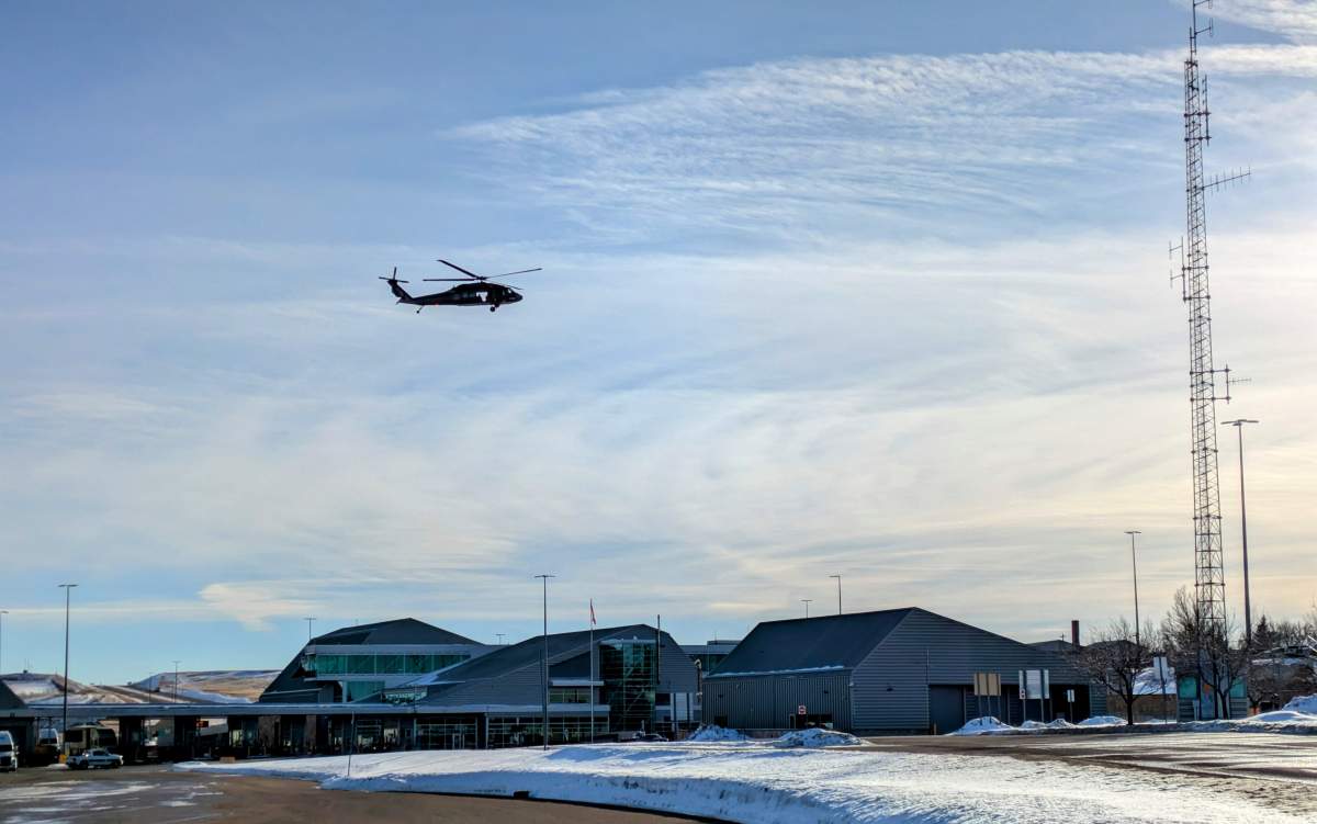 A RCMP Black Hawk helicopter over the Coutts Border Crossing in southern Alberta on Tuesday, January 28, 2025.