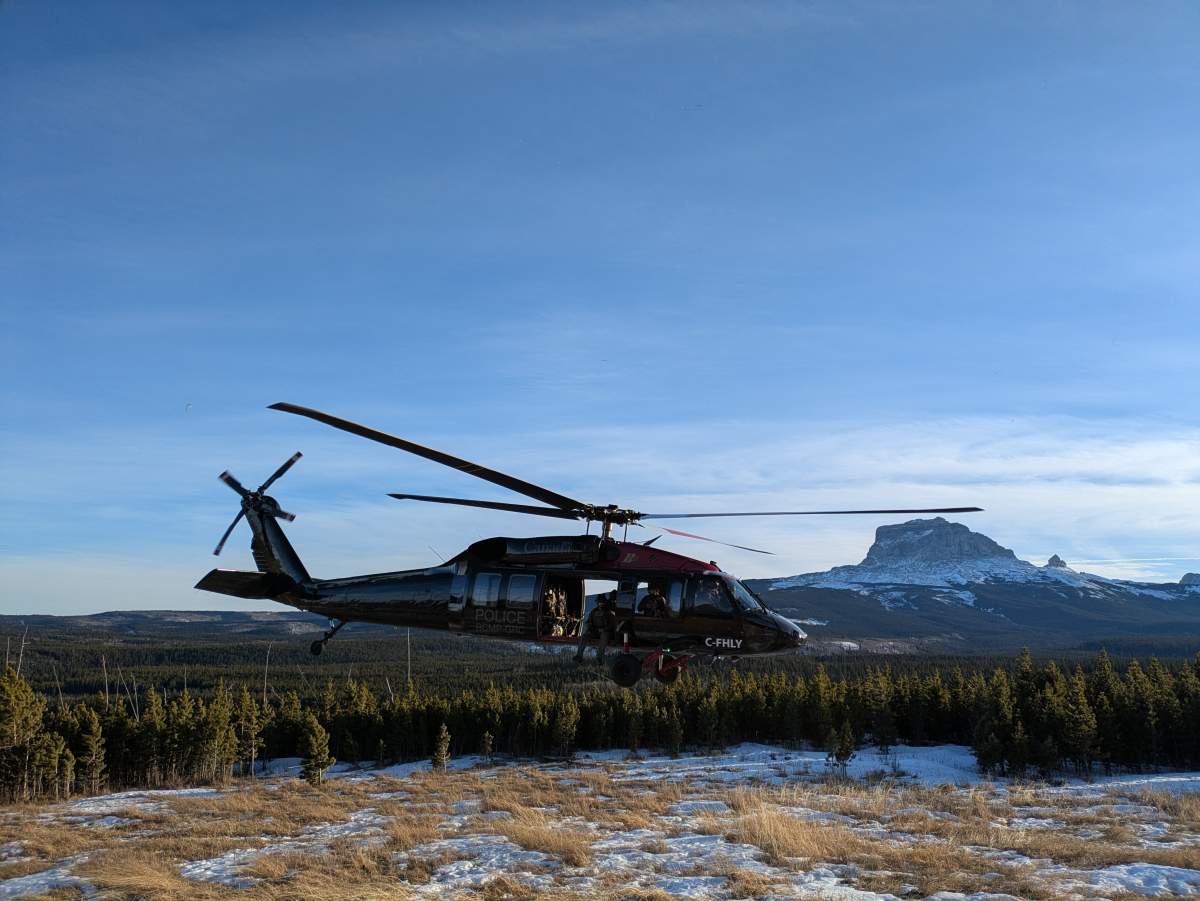 A RCMP Black Hawk helicopter near the Rocky Mountains in southern Alberta on Tuesday, January 28, 2025.