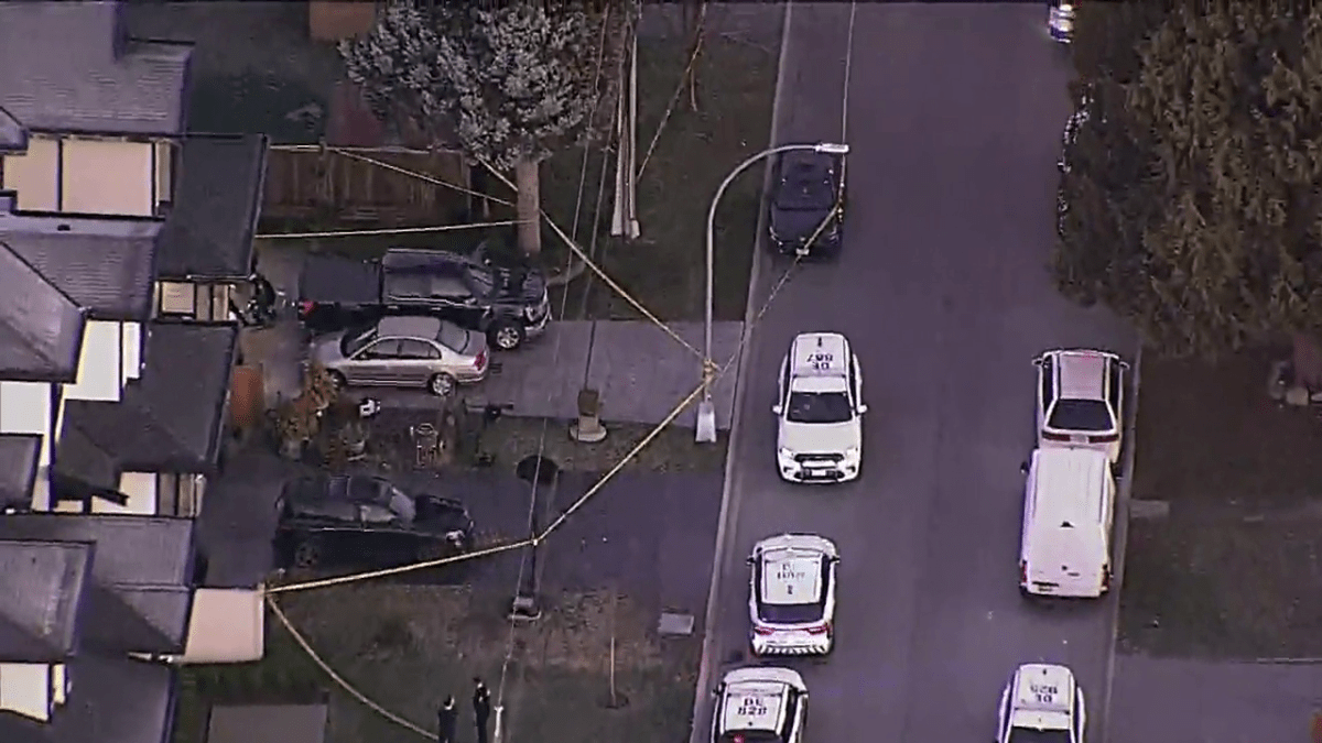 Police tape up and officers on the scene at a crime scene in Delta on Monday morning.