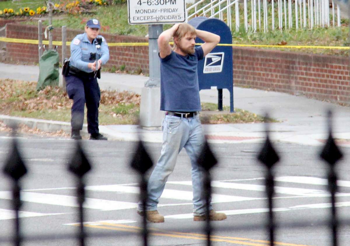 Edgar Maddison Welch, of Salisbury, N.C., surrenders to police in Washington on Dec. 4, 2016.