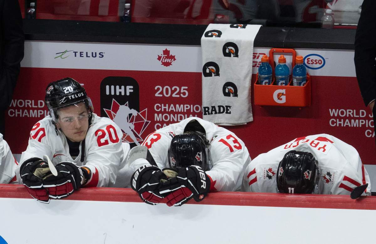 Canada forward Ethan Gauthier (20) sits on the bench alongside teammates Luca Pinelli (13) and Brayden Yager (11) during third period IIHF World Junior Hockey Championship quarterfinal action as they lose 4-3 to Czechia, in Ottawa, Thursday, Jan. 2, 2025.