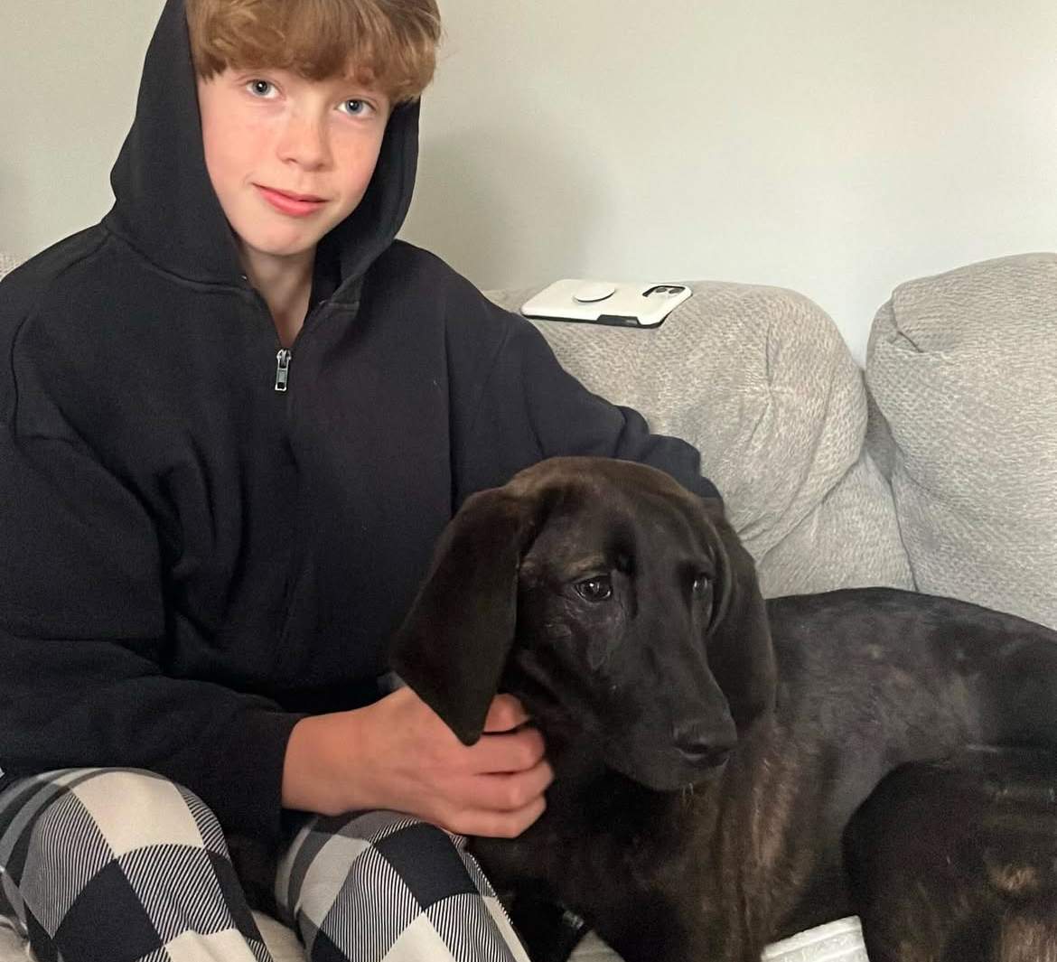 Nicole Brickell's son with their new dog Charlie
