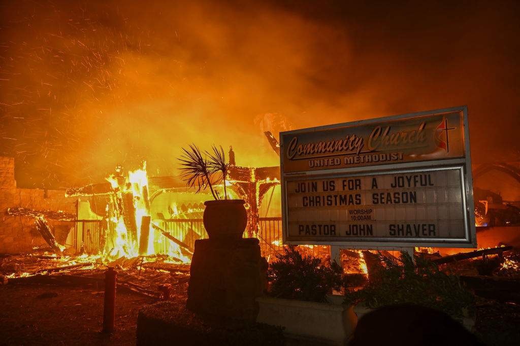 A house in on fire as residents try to escape the site in Pacific Palisades, California, Los Angeles, United States on January 8, 2025.