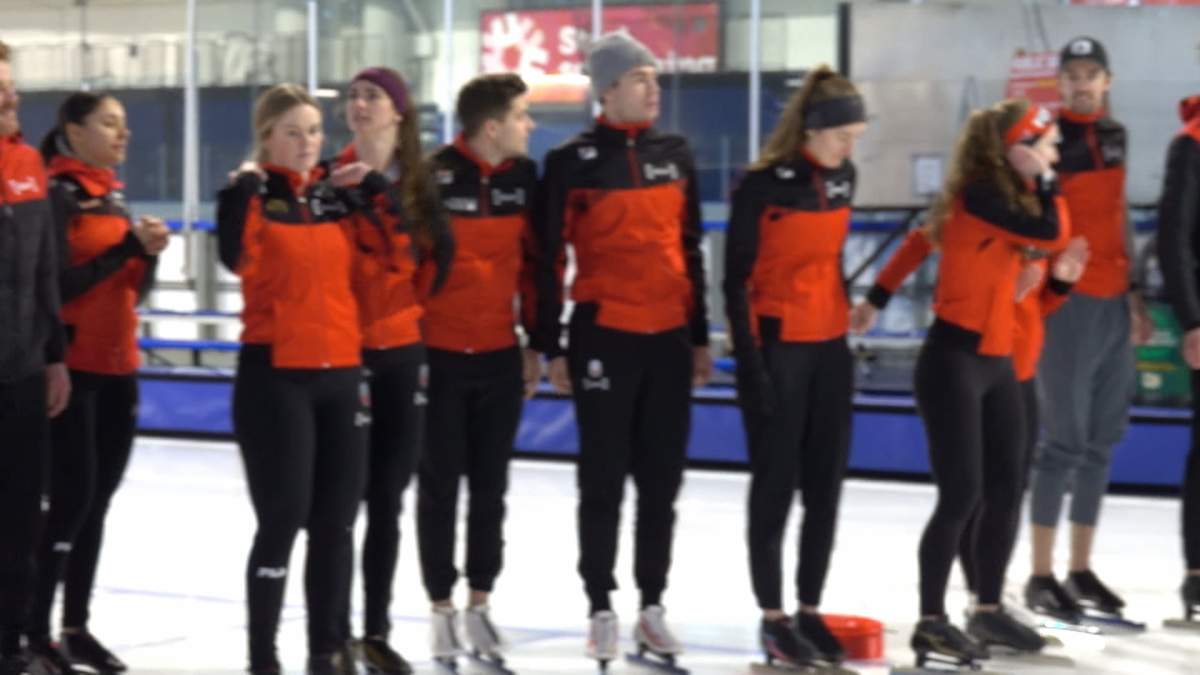 Members of Canada national long track speedskating team gather for a photo op at Calgary's Olympic Oval as they prepare to take part in the ISU World Cup Speedskating event at the facility later this month.