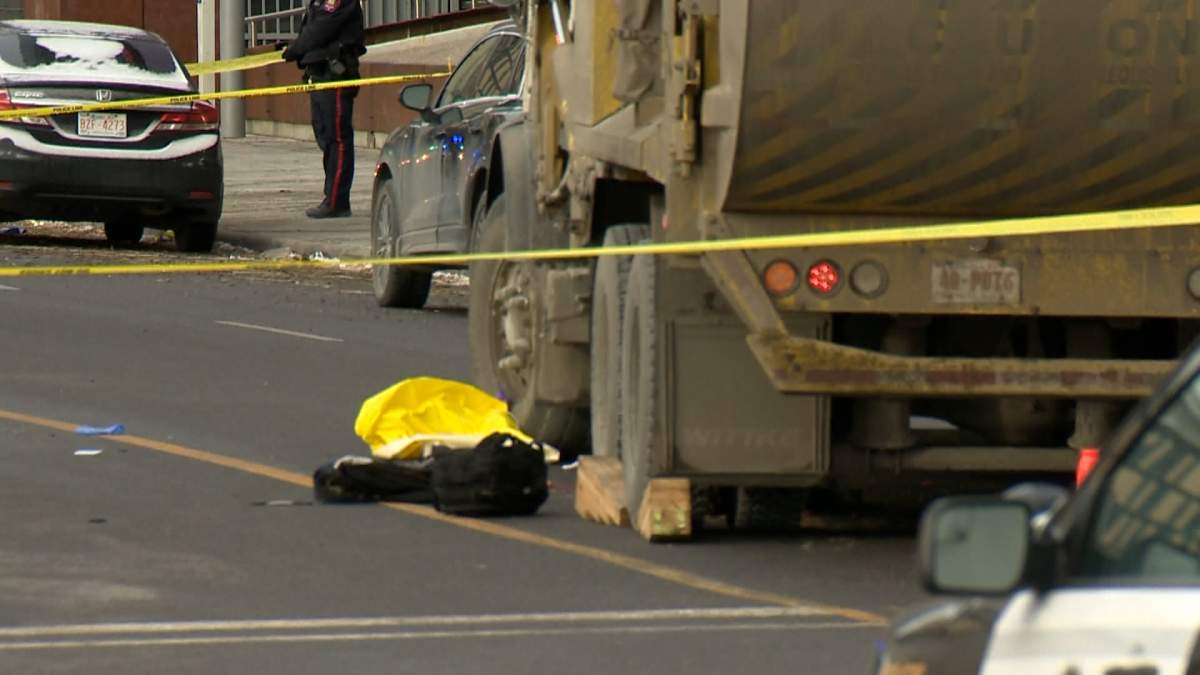 A truck and what appears to be a person's belongings are surrounded by yellow police tape after a person was rushed to hospital in critical condition after being struck by a vehicle at the intersection of 6th Ave. and 4th St. SE in Calgary Friday morning.