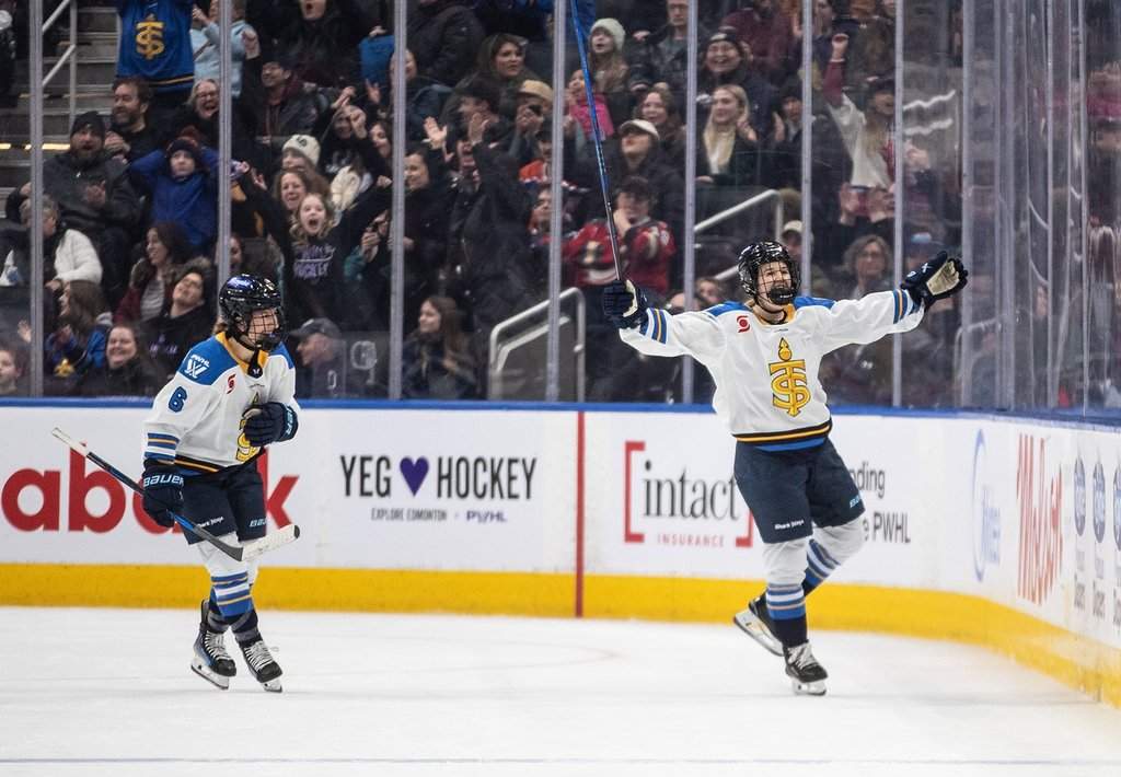Toronto Sceptres' Daryl Watts (9) and Kali Flanagan (6) celebrate a goal against the Ottawa Charge during overtime PWHL action in Edmonton, Sunday, Feb. 16, 2025.