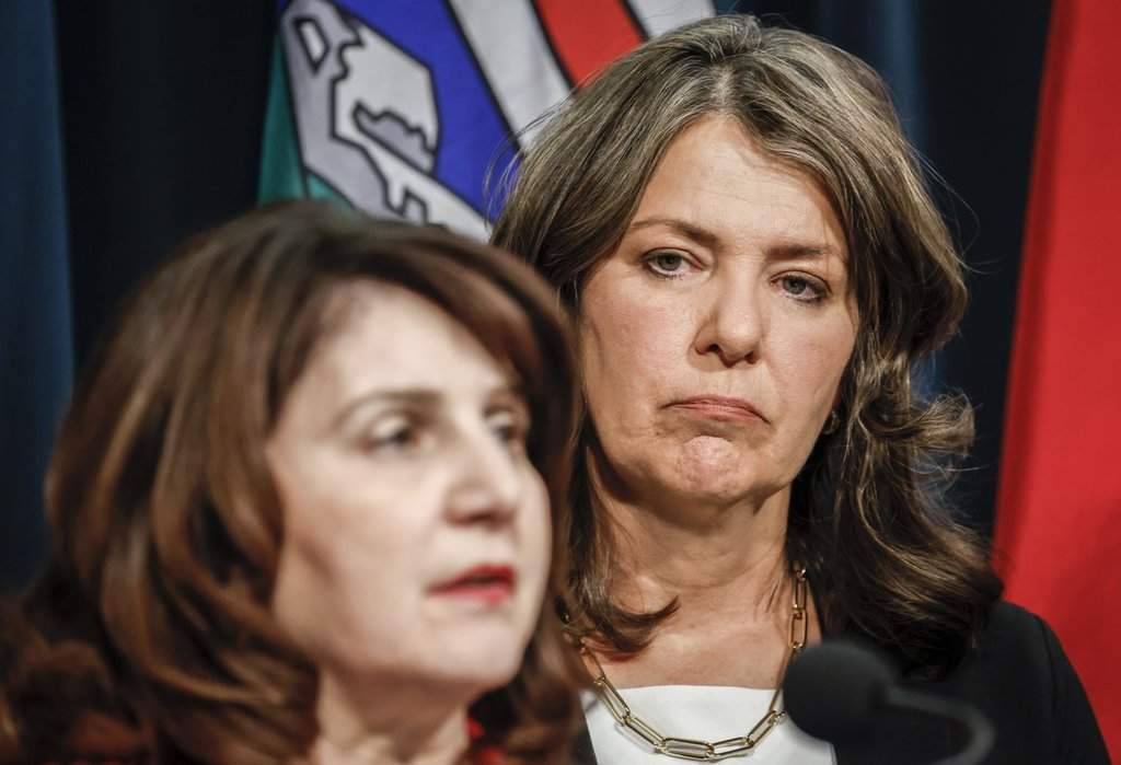Alberta Premier Danielle Smith, right, and Minister of Health Adriana LaGrange provide an update on what steps the government is taking related to allegations by former Alberta Health Services CEO Athana Mentzelopoulos, in Calgary, Wednesday, Feb. 19, 2025. THE CANADIAN PRESS/Jeff McIntosh.