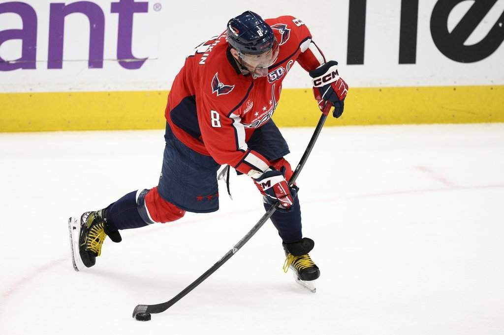 Washington Capitals left wing Alex Ovechkin winds up for a shot during the third period of an NHL hockey game against the Calgary Flames, Tuesday, Feb. 25, 2025, in Washington.