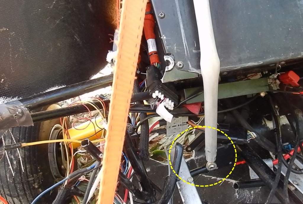 Wreckage of an ultralight aircraft, with aircraft control elements, specifically the push tube rod end and control column bellcrank, circled, is seen in an undated handout photo which appears in the TSB investigation report. THE CANADIAN PRESS/HO-TSB, Uttam Bhandari.