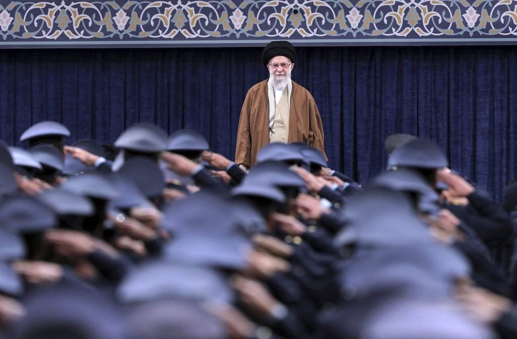 Iranian Supreme Leader Ayatollah Ali Khamenei listens to the national anthem as air force officers salute, Tehran, Iran, Feb. 7, 2025. (Office of the Iranian Supreme Leader via AP)