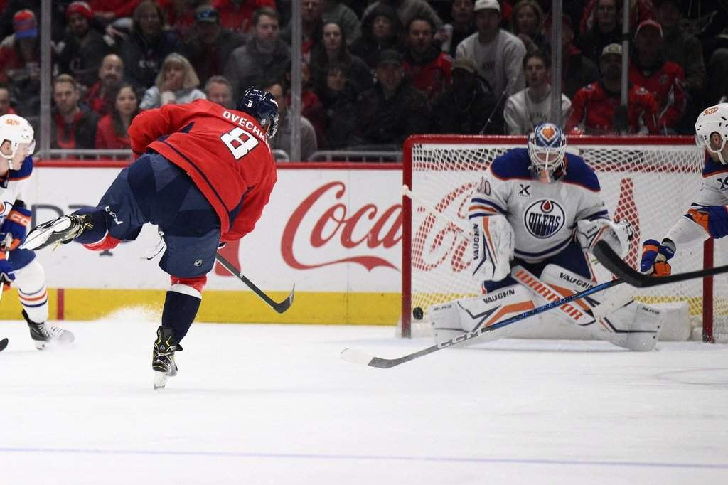 Washington Capitals left wing Alex Ovechkin (8) scores against Edmonton Oilers goaltender Calvin Pickard (30) during the second period of an NHL hockey game, Sunday, Feb. 23, 2025, in Washington.