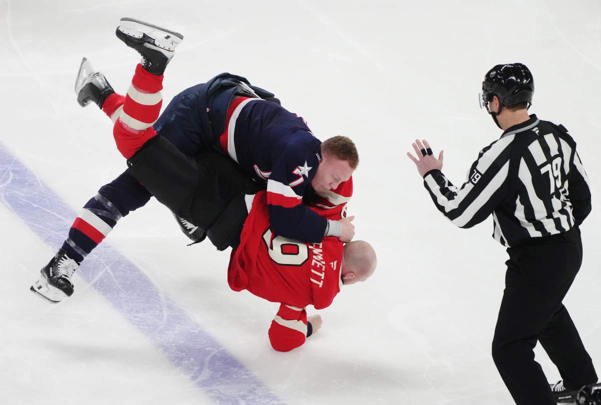 United States' Brady Tkachuk (top) fights Canada's Sam Bennett (9) during first period 4 Nations Face-Off hockey action in Montreal on Saturday, Feb. 15, 2025.