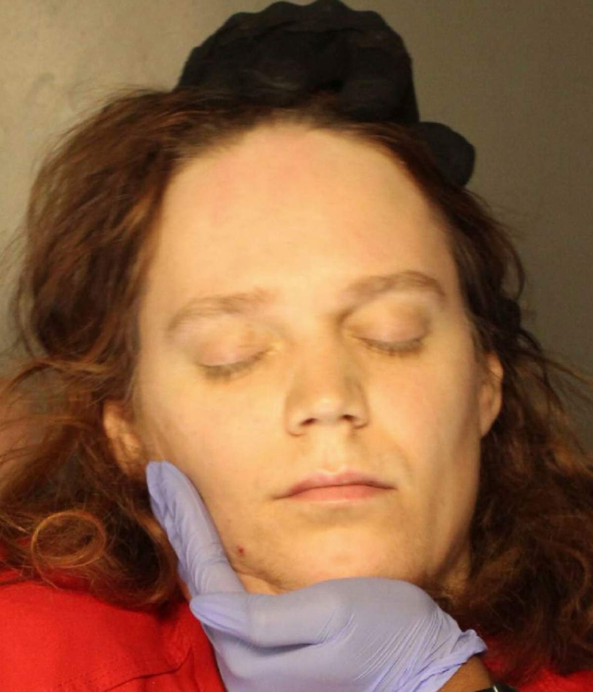 In this Jan. 2023 booking photo provided by the Delaware County, Pennsylvania, District Attorney's Office, Jack LaSota refused to speak and kept her eyes closed while being photographed after being detained in a hotel in suburban Pennsylvania on Jan. 23, 2023.