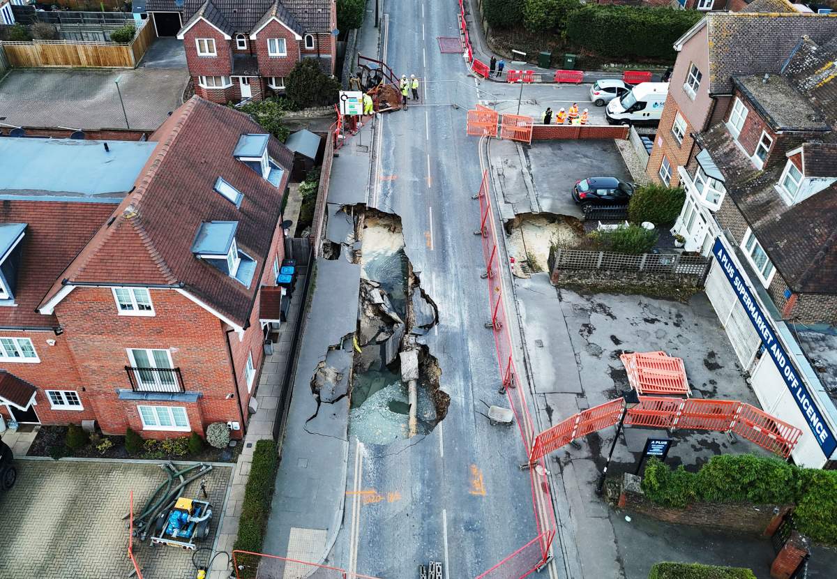 A large sinkhole appeared on Monday night is seen in Godstone, England, Tuesday Feb. 18, 2025. (Jonathan Brady/PA via AP)