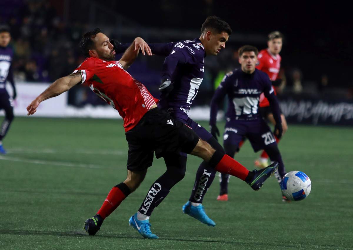 Cavalry FC's Sergio Camargo kicks the ball away from Pumas UNAM's Rodrigo Lopez during second half soccer action in round one of the 2025 CONCACAF Champions Cup in Langford, B.C., on Thursday, February 6, 2025.