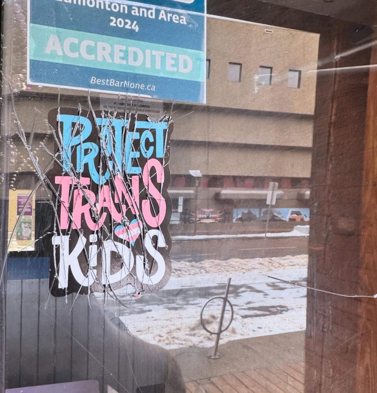 The window of Evolution Wonderlounge was defaced in downtown Edmonton in December 2024.