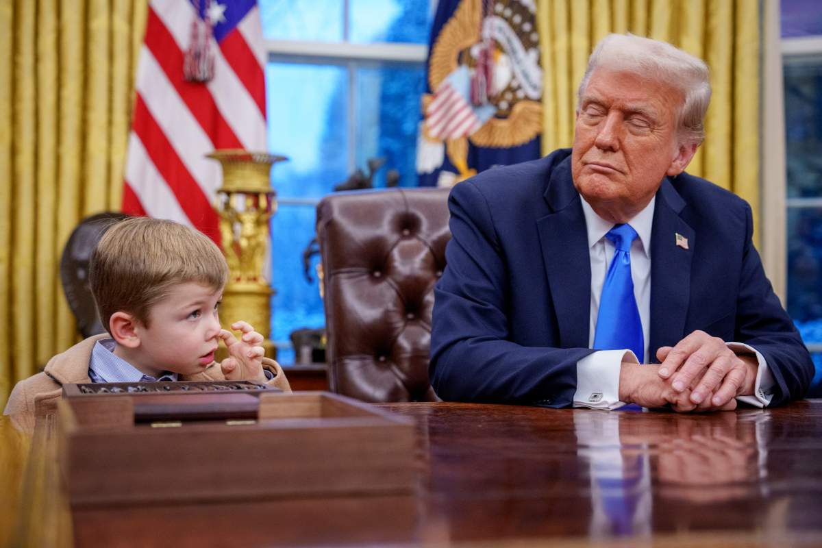 X Musk, the son of Tesla and SpaceX CEO Elon Musk, stands next to U.S. President Donald Trump during an executive order signing in the Oval Office at the White House on February 11, 2025 in Washington, DC.