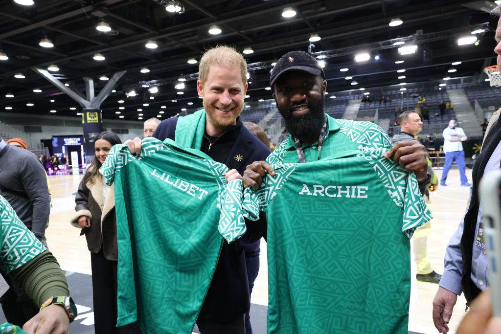 Prince Harry, Duke of Sussex poses with a member of Team Nigeria at the USA vs. Nigeria Wheelchair Basketball Pool Play at Vancouver Convention Centre on Feb. 9, 2025 in Vancouver, British Columbia.