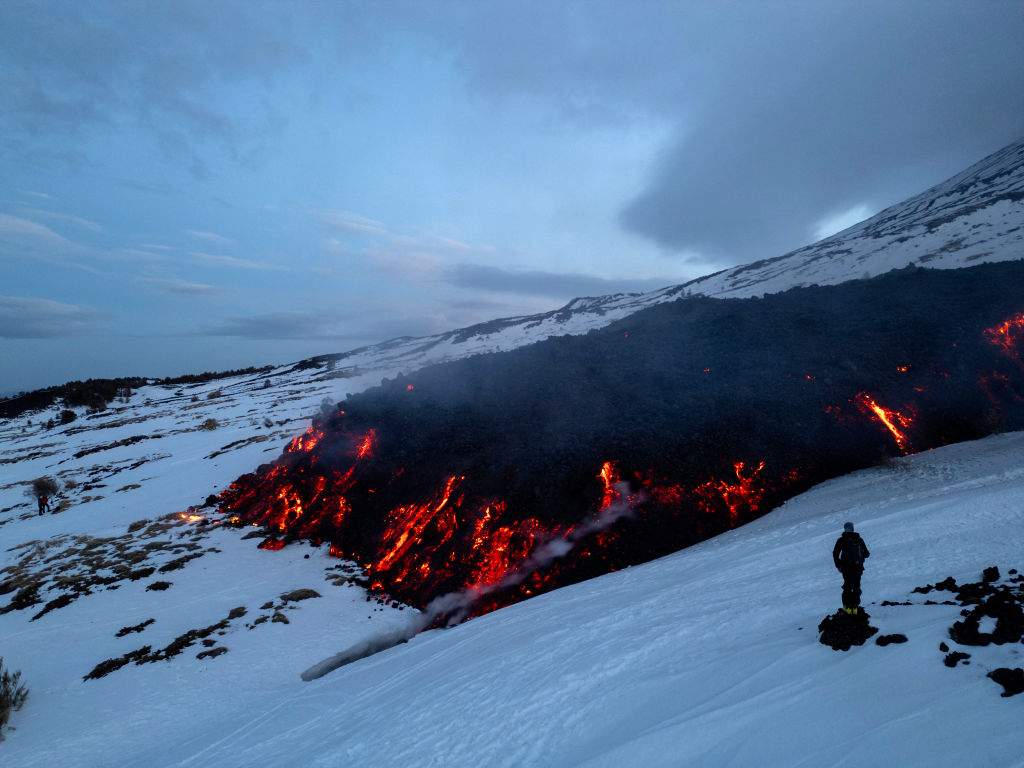 Lava flows from a fracture on the Mount Etna during an eruption of the volcano on February 14, 2025.