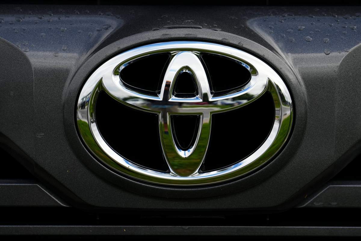 A Toyota vehicle logo is pictured on a car at an automotive dealership in Ottawa on Friday, Aug. 11, 2023.
