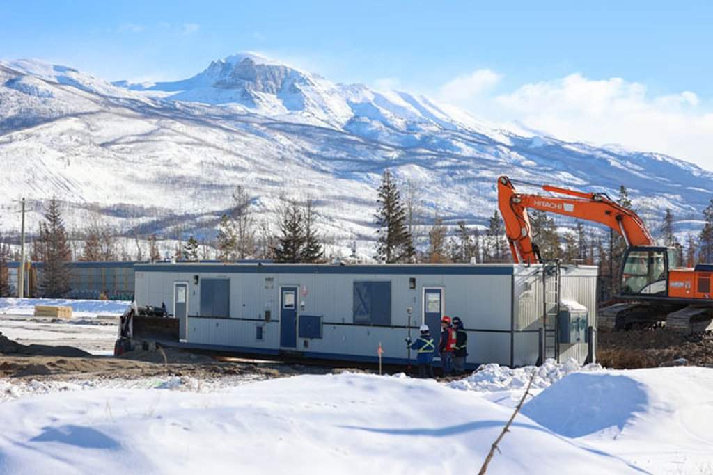 Workers set up temporary housing units which will be occupied by locals who lost their homes in last summer's wildfire in Jasper, Alberta on Tuesday, Feb. 12, 2024.
