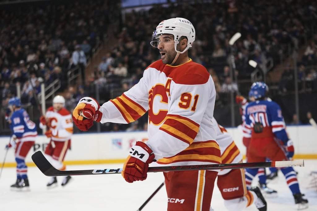 Calgary Flames' Nazem Kadri (91) celebrates after scoring a goal during the first period of an NHL hockey game against the New York Rangers Tuesday, March 18, 2025, in New York.