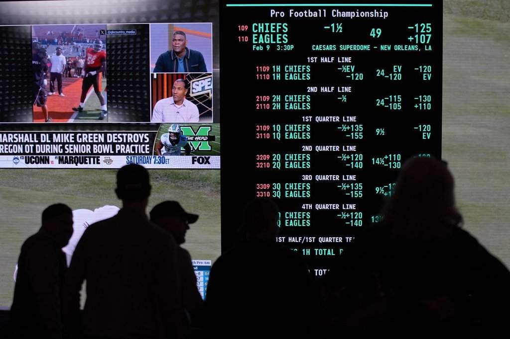 FILE - Betting odds for Super Bowl LIX are displayed on monitors at the Circa resort and casino sports book, Jan. 30, 2025, in Las Vegas. (AP Photo/John Locher, File).
