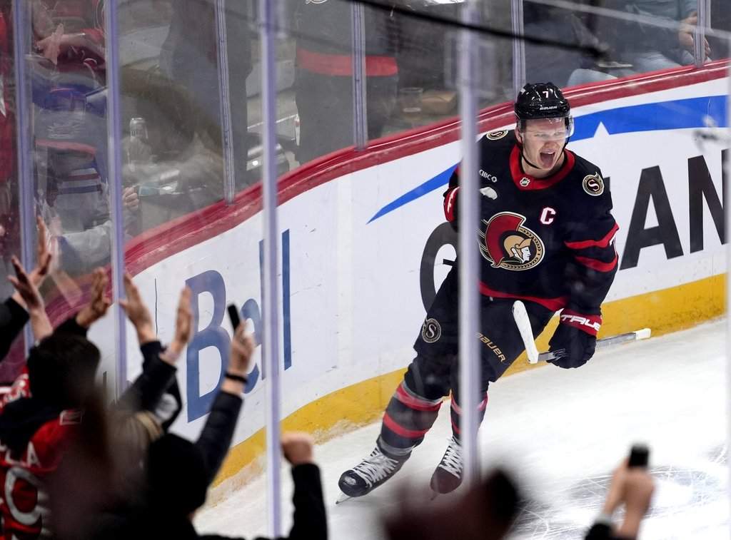 Ottawa Senators' Brady Tkachuk (7) celebrates his game winning goal against the New York Rangers during overtime period NHL hockey action in Ottawa, on Saturday, March 8, 2025.