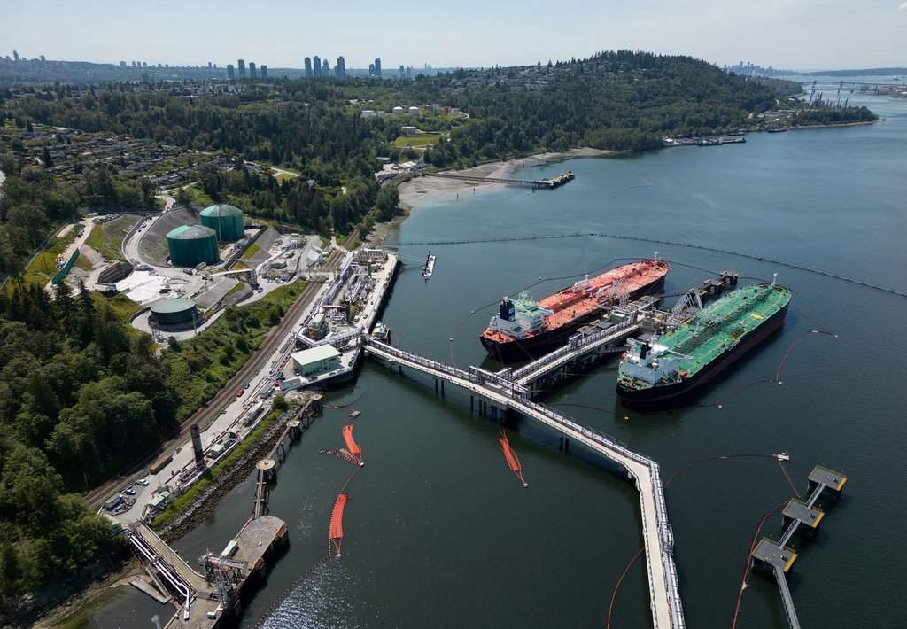 Crude oil tankers SFL Sabine, left, and Tarbet Spirit are seen docked at the Trans Mountain Westridge Marine Terminal, where crude oil from the expanded Trans Mountain Pipeline is loaded onto tankers, in Burnaby, B.C., Monday, June 10, 2024.