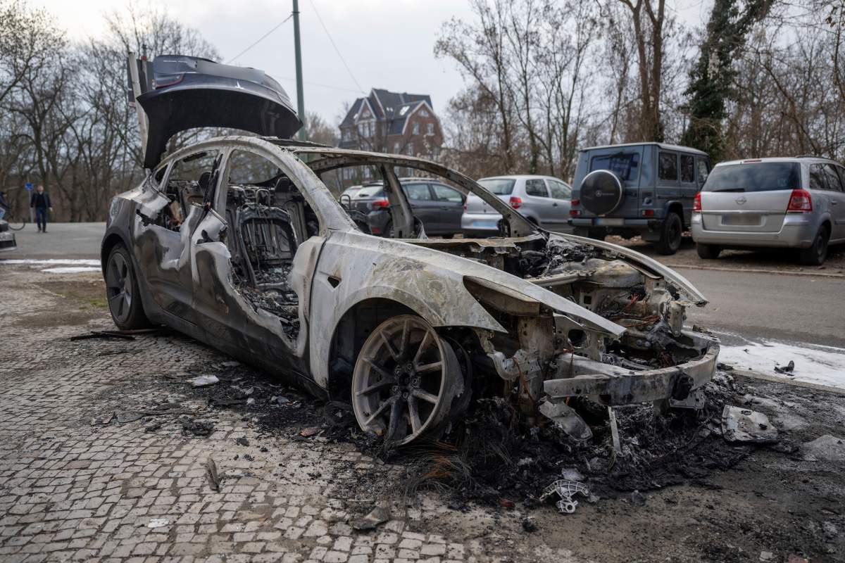 A burnt-out Tesla car stands in the Steglitz district of Berlin, Friday, March 14, 2025, as four Teslas are suspected to have been set on fire in Berlin.