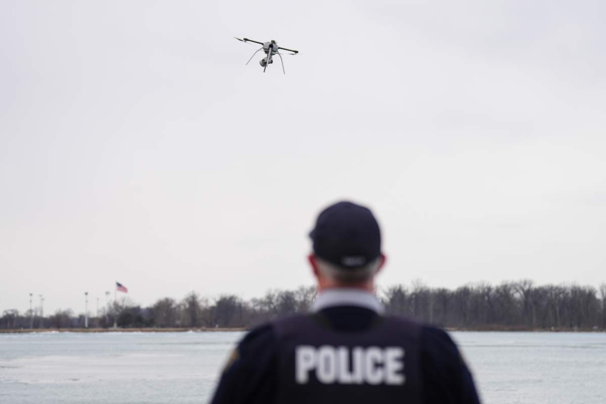 Const. Ian Smith of the RCMP's Border Integrity Unit looks on as trucks line up on the Ambassador Bridge to pass through the Canadian border in Windsor, Ont. on Friday, March 7, 2025. 