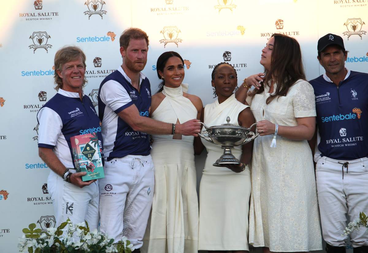 The Duchess of Sussex presents the trophy to her husband, the Duke of Sussex after his team the Royal Salute Sentebale Team defeated the Grand Champions Team, in the Royal Salute Polo Challenge, to benefit Sentebale, at The USPA National Polo Center in Wellington, Florida, US. Picture date: Friday April 12, 2024.