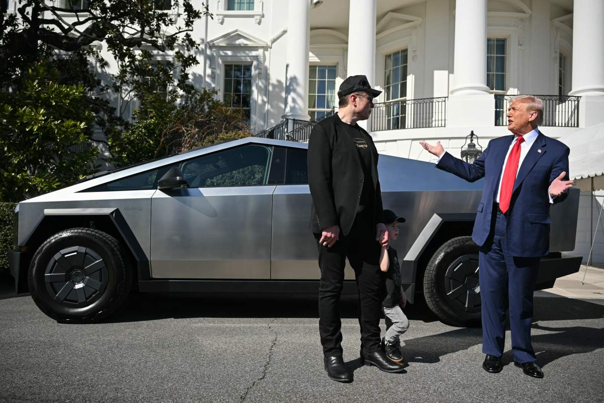 President Donald Trump and Tesla CEO Elon Musk speak to the press as they stand next to a Tesla Cybertruck on the South Portico of the White House on March 11, 2025 in Washington, DC. (Photo by Mandel NGAN / AFP) (Photo by MANDEL NGAN/AFP via Getty Images)