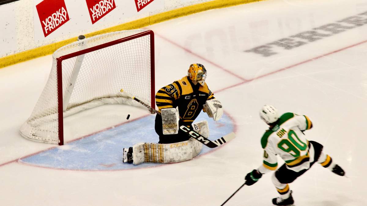 Landon Sim of the London Knights watches his second period goal go past Ryerson Leenders of the Brantford Bulldogs in London victory over Brantford on March 5, 2025.