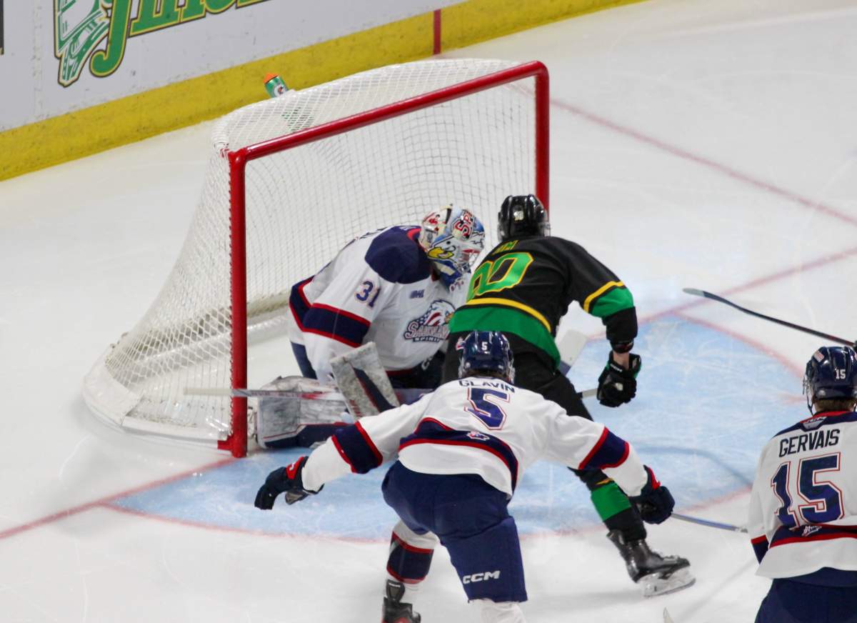 Landon Sim of the London Knights scores one of his two goals against the Saginaw Spirit in a 3-1 London victory at Canada Life Place on March 14, 2025.