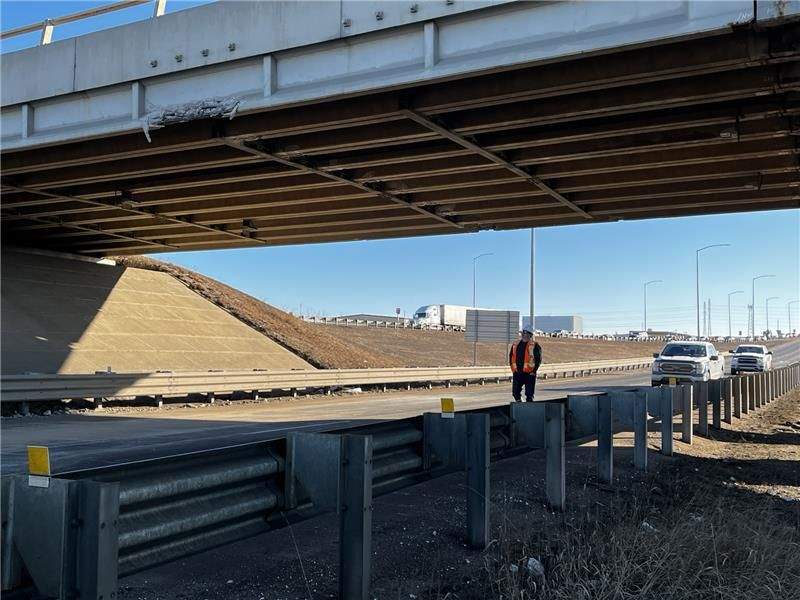 An overpass on Edmonton's eastern outskirts sustained damage when it was struck by a semi-truck late Monday night and drivers reported delays in the area as a result of closures on Tuesday morning.