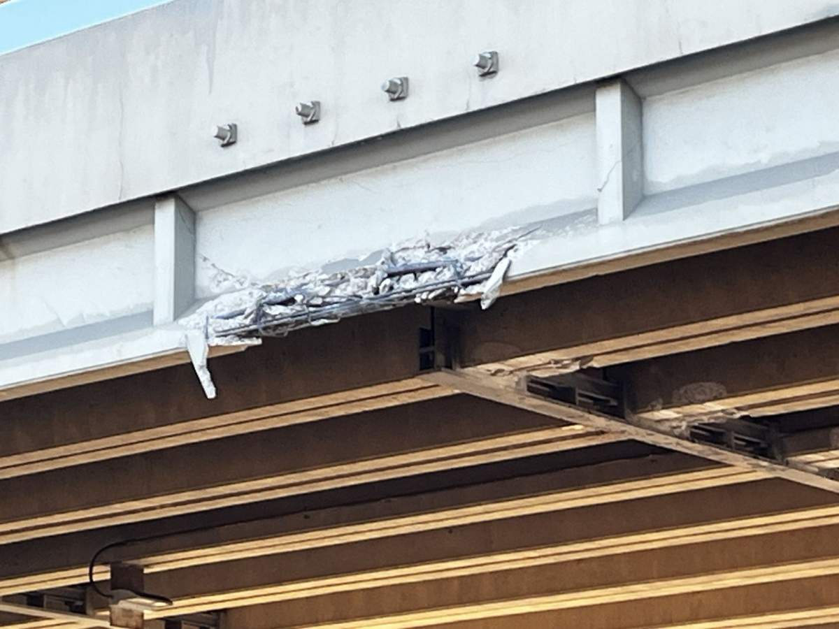 An overpass on Edmonton's eastern outskirts sustained damage when it was struck by a semi-truck late Monday night and drivers reported delays in the area as a result of closures on Tuesday morning.