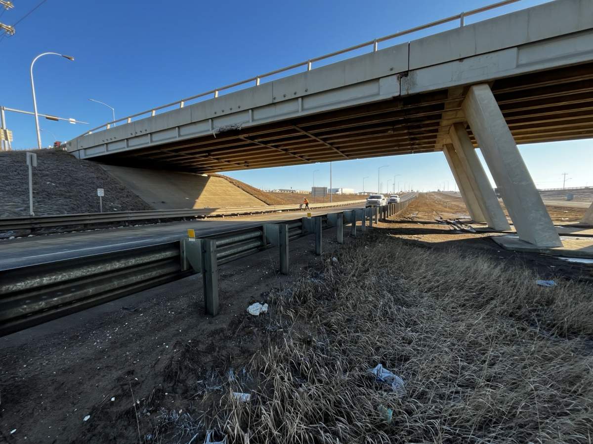 An overpass on Edmonton's eastern outskirts sustained damage when it was struck by a semi-truck late Monday night and drivers reported delays in the area as a result of closures on Tuesday morning.