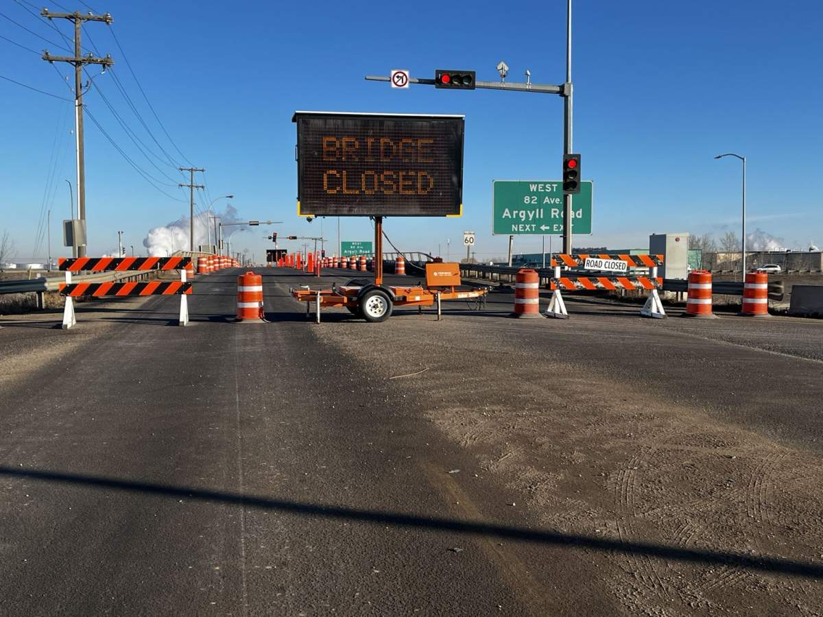 An overpass on Edmonton's eastern outskirts sustained damage when it was struck by a semi-truck late Monday night and drivers reported delays in the area as a result of closures on Tuesday morning.