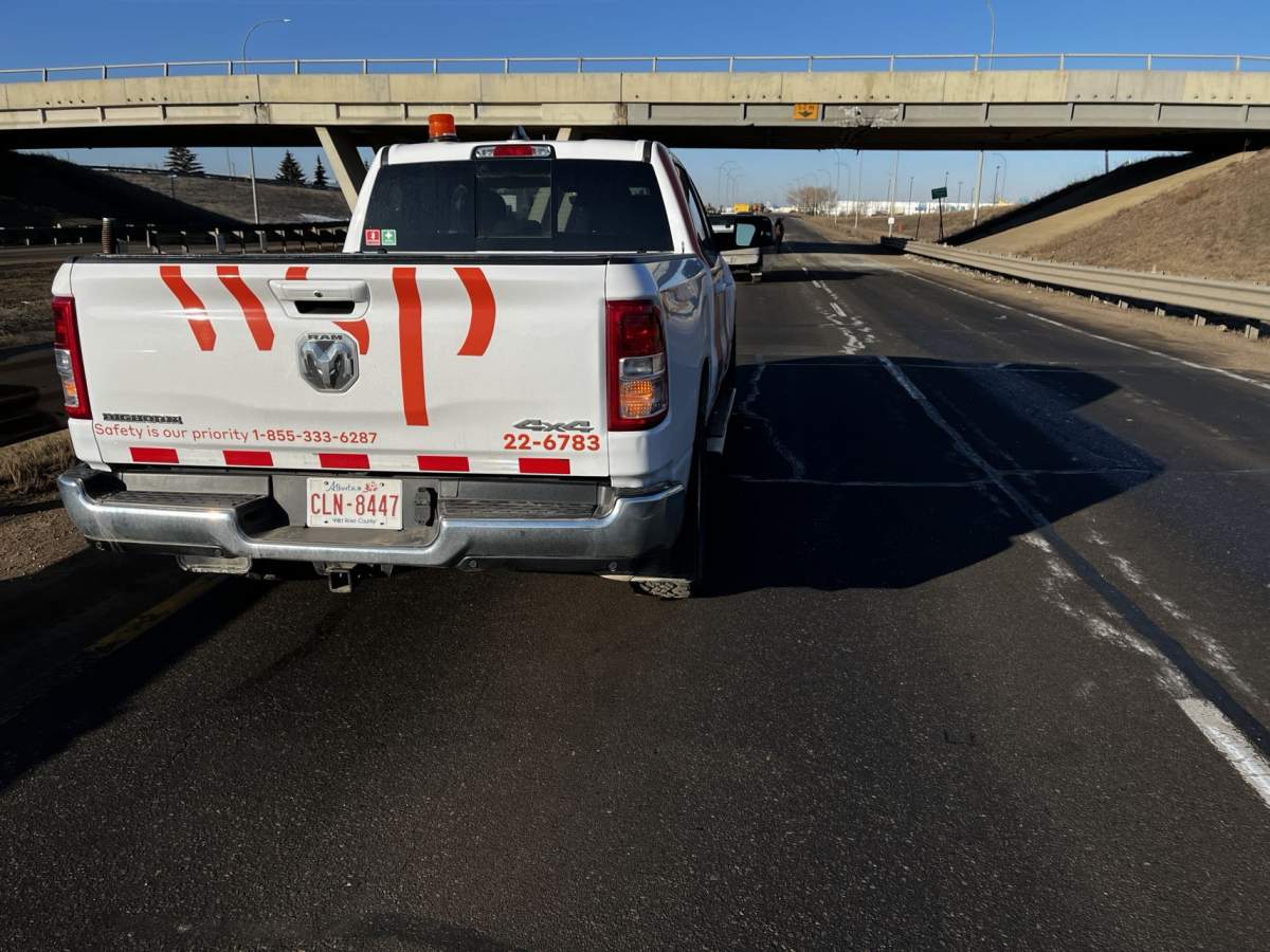 An overpass on Edmonton's eastern outskirts sustained damage when it was struck by a semi-truck late Monday night and drivers reported delays in the area as a result of closures on Tuesday morning.