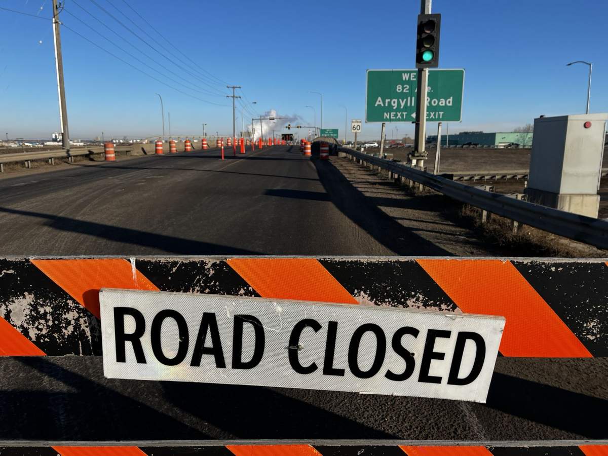 An overpass on Edmonton's eastern outskirts sustained damage when it was struck by a semi-truck late Monday night and drivers reported delays in the area as a result of closures on Tuesday morning.