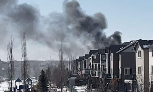 The flames and smoke from this Airdrie house fire were so intense that firefighters had to go into defensive mode shortly after the arrived to prevent the fire from spreading to other homes.