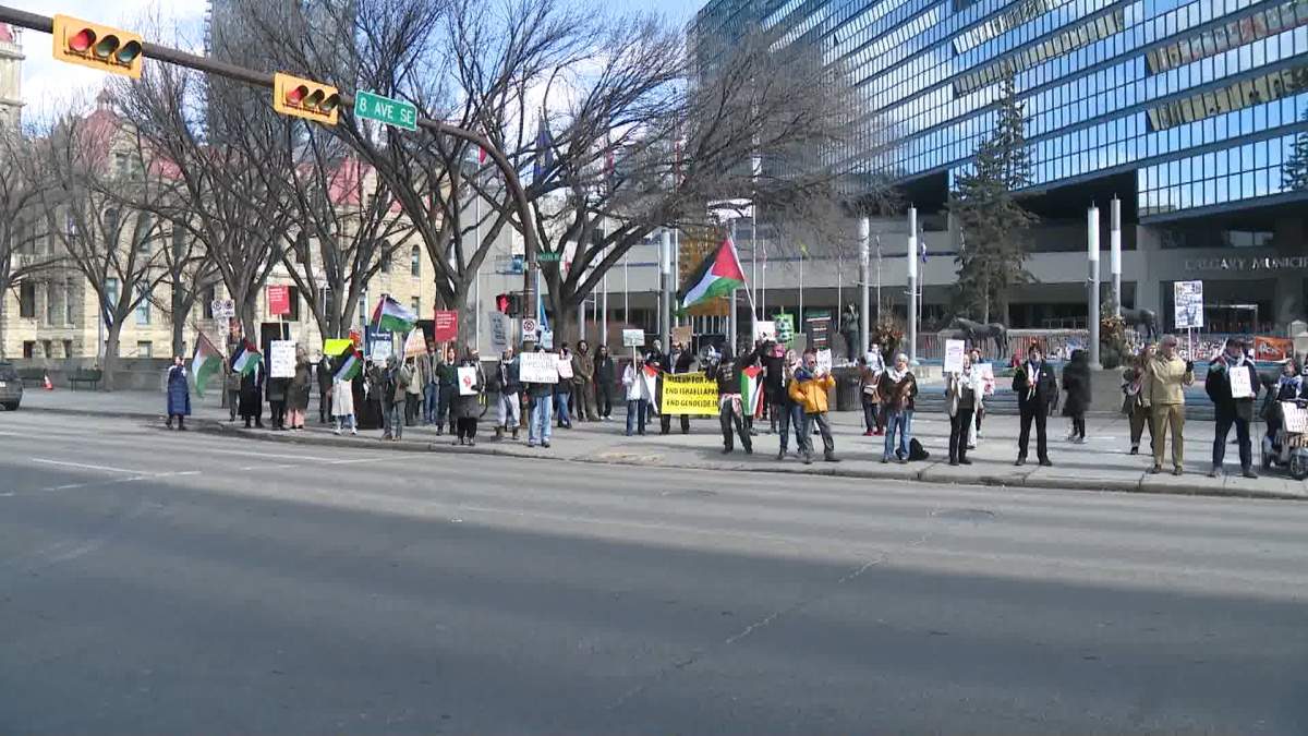 A large crowd of protestors gathered in front of Calgary city hall on Tuesday to condemn Israel over a new round of airstrikes on the Gaza strip.